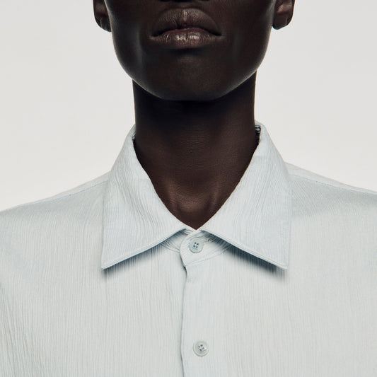 Pleated shirt with shark collar