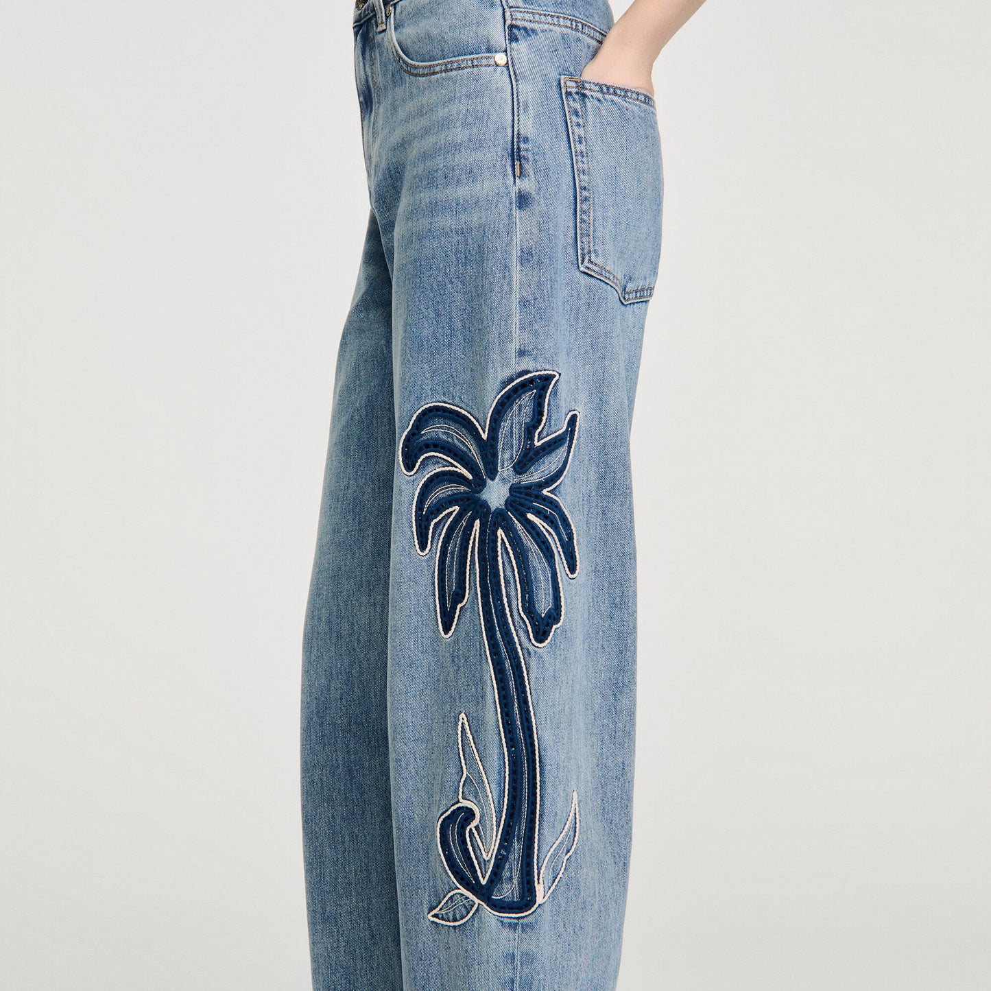 Palm-embroidered wide barrel jeans