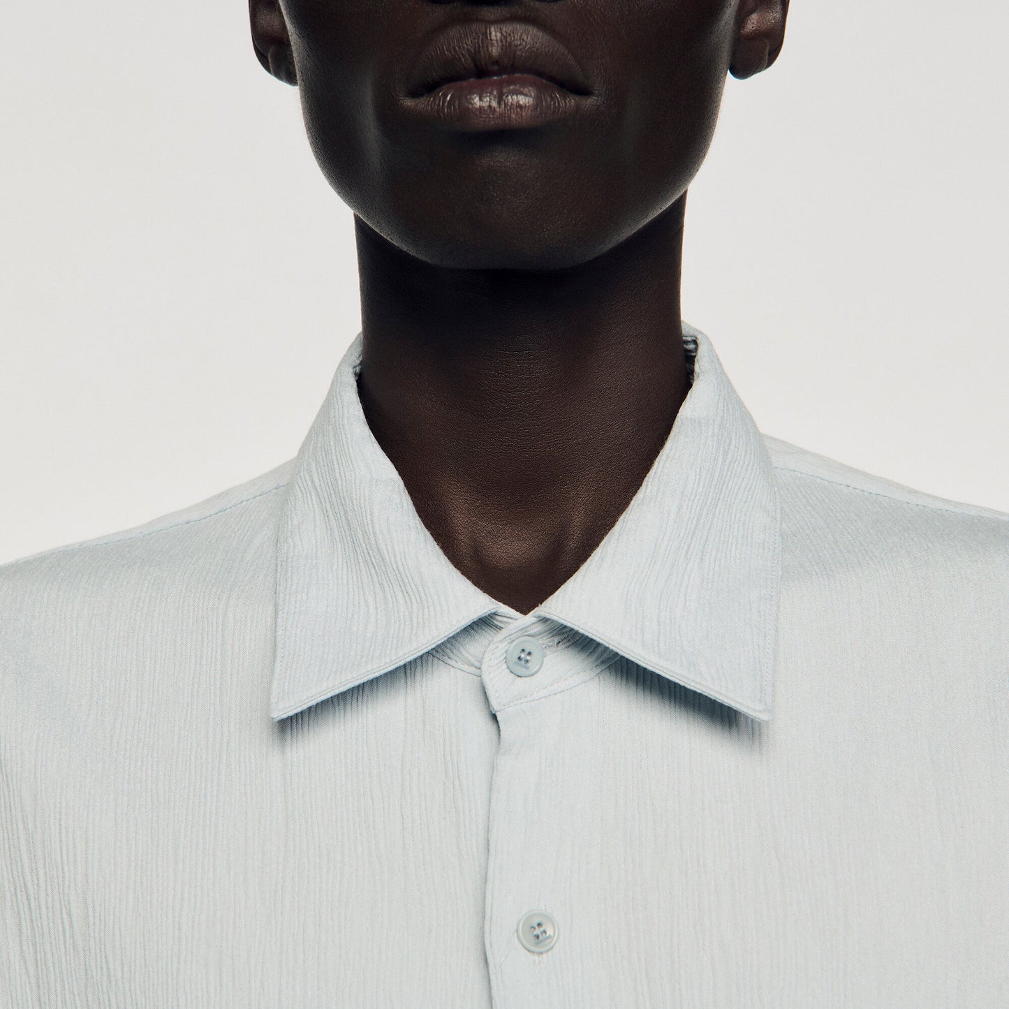 Pleated shirt with shark collar