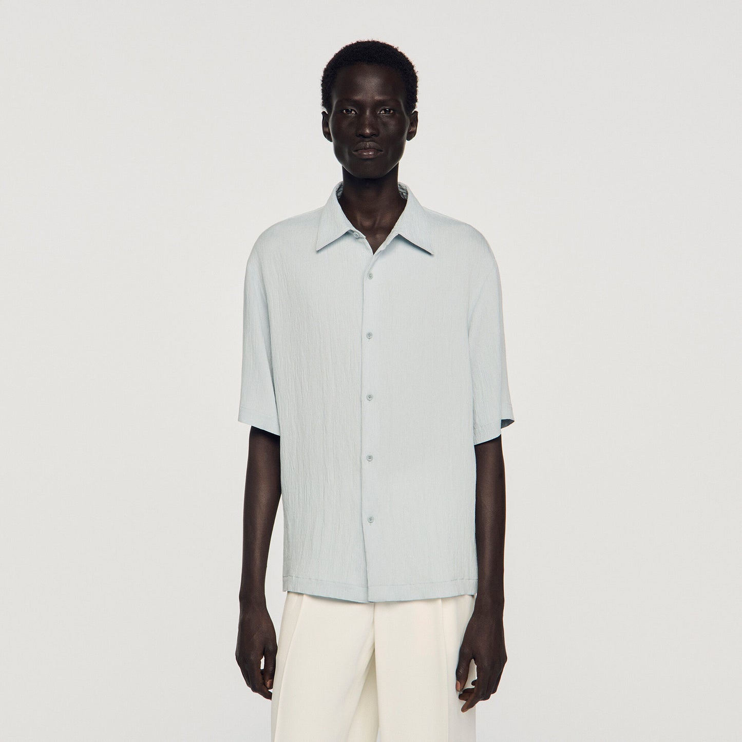 Pleated shirt with shark collar